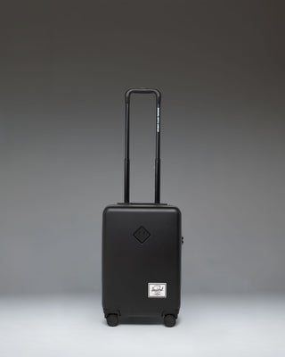 Herschel Supply Co. Heritage Hardshell Carry On Luggage in black.
