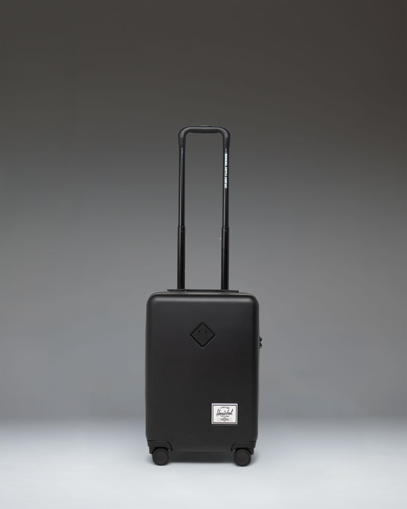 Herschel Supply Co. Heritage Hardshell Carry On Luggage in black.