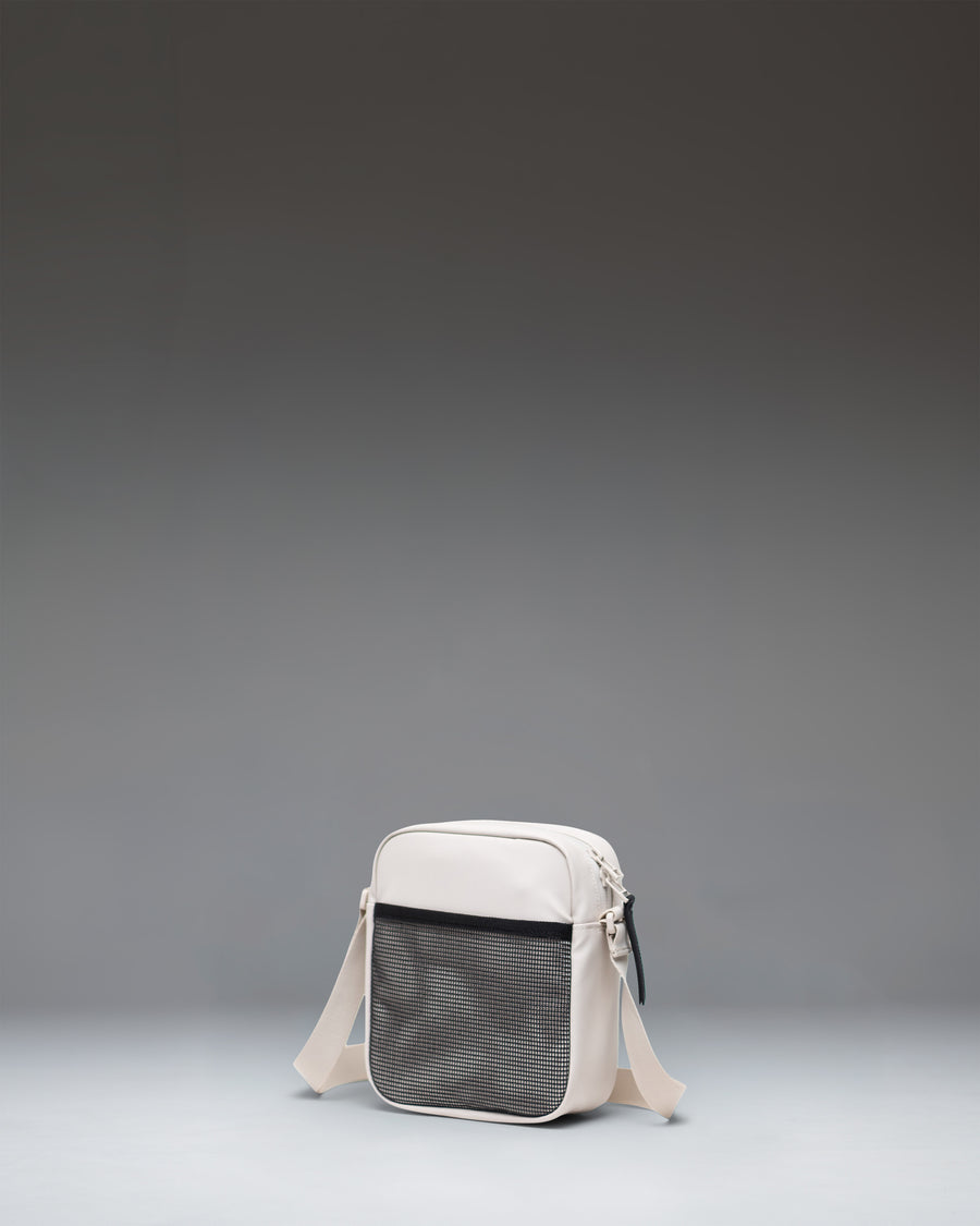 Herschel Heritage Crossbody bag in Moonbeam Tonal, showing the front view with zipper detail.