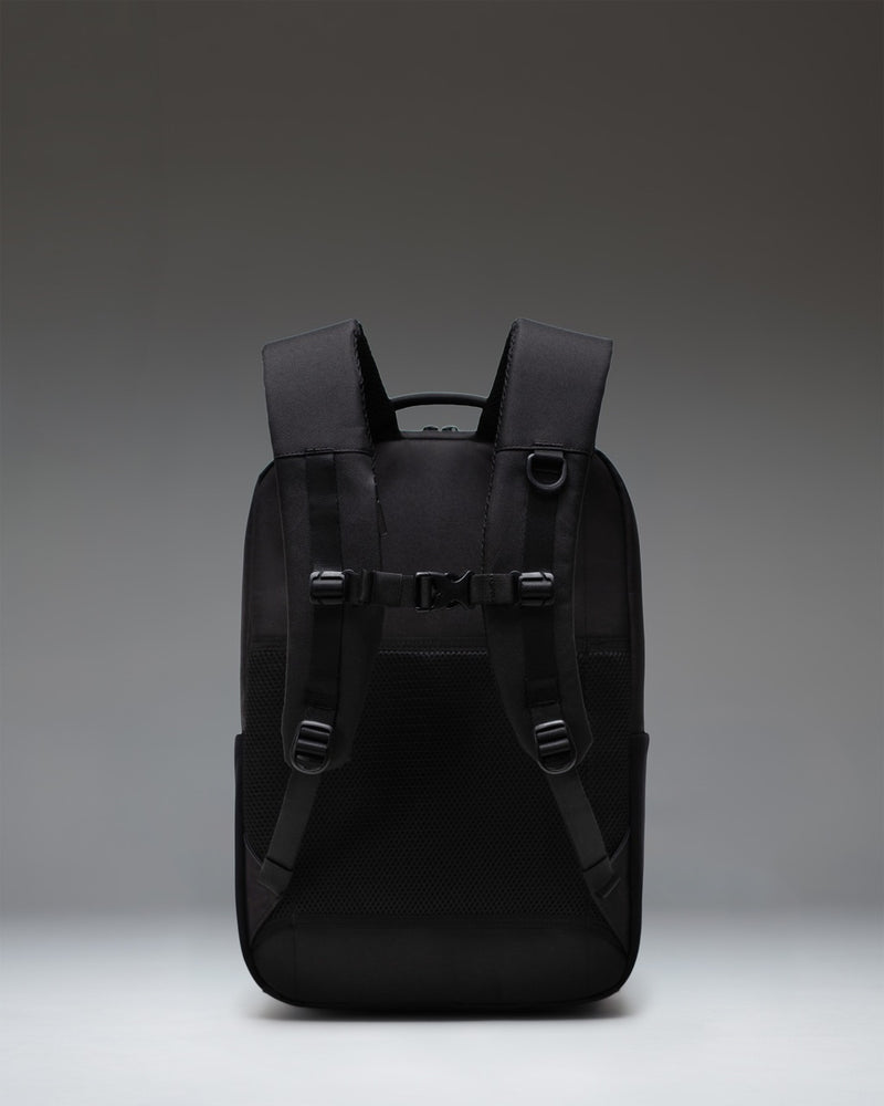 Herschel Supply Co. Kaslo Daypack Tech in black, showing the front view with sleek zippers and minimalist design.