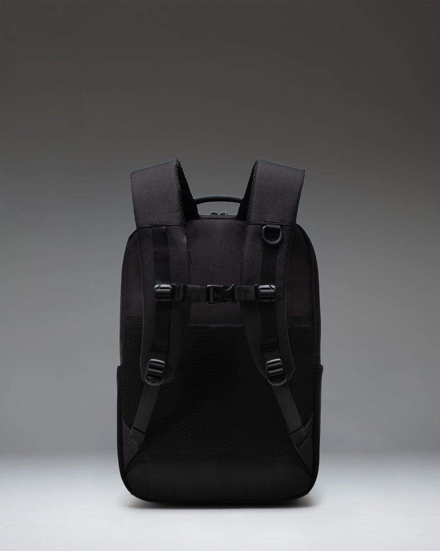 Herschel Supply Co. Kaslo Daypack Tech in black, showing the front view with sleek zippers and minimalist design.