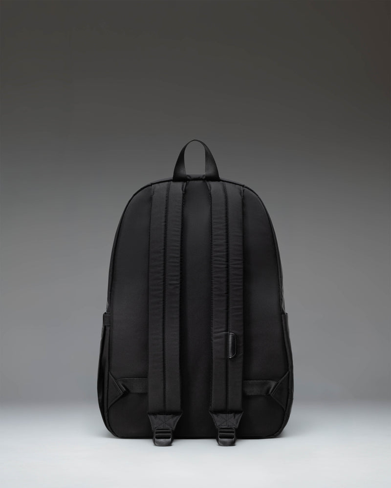Black Herschel Heritage Backpack showing its classic design with a front pocket and signature diamond detail.