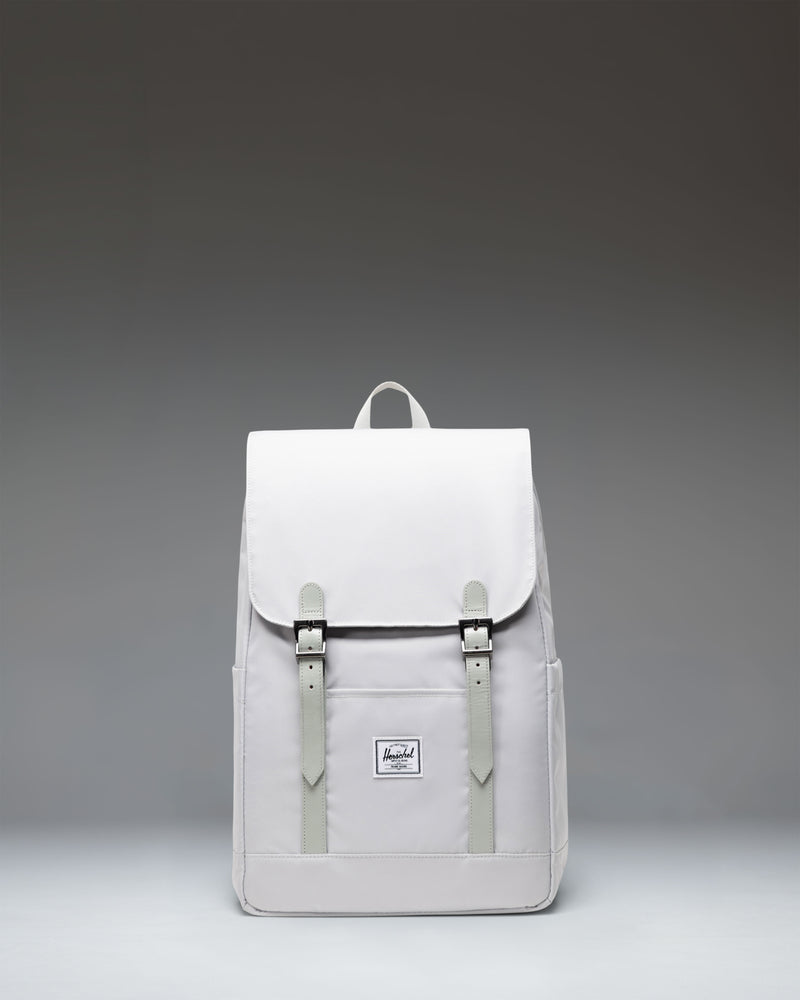 Herschel Retreat Small Backpack in Metal, front view showing the classic design with dual strap closures and a woven label.