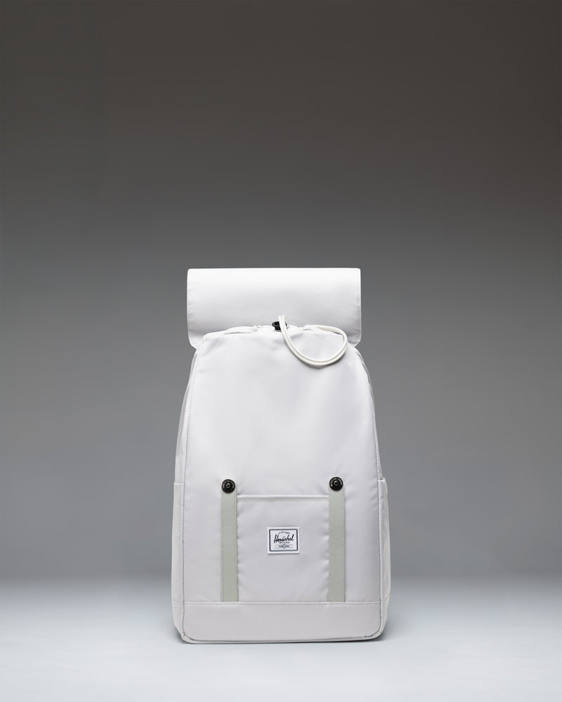 Herschel Supply Co. Retreat Small Backpack in Metal gray, featuring a drawstring closure and two front straps with metal pin buckles.