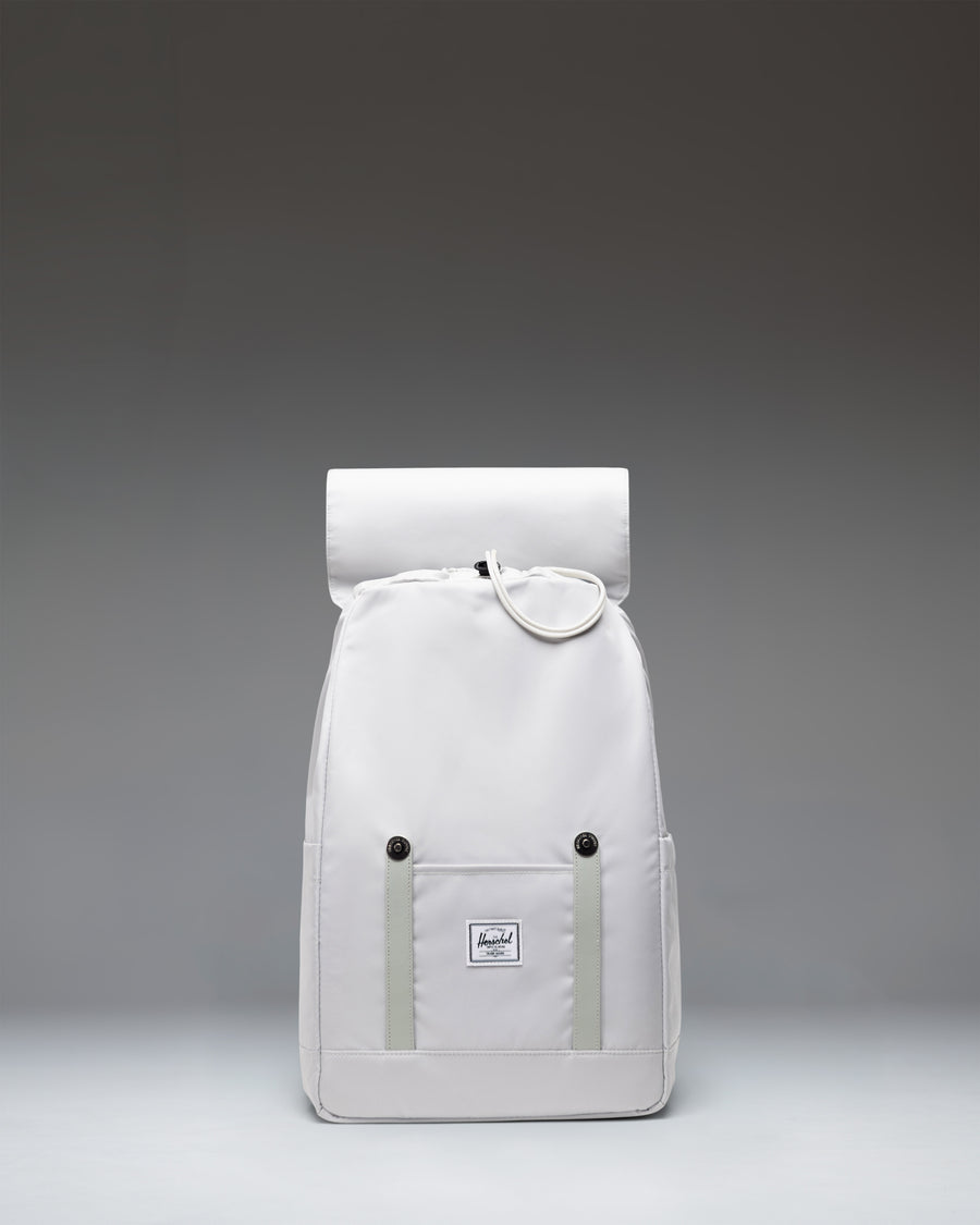Herschel Supply Co. Retreat Small Backpack in Metal gray, featuring a drawstring closure and two front straps with metal pin buckles.