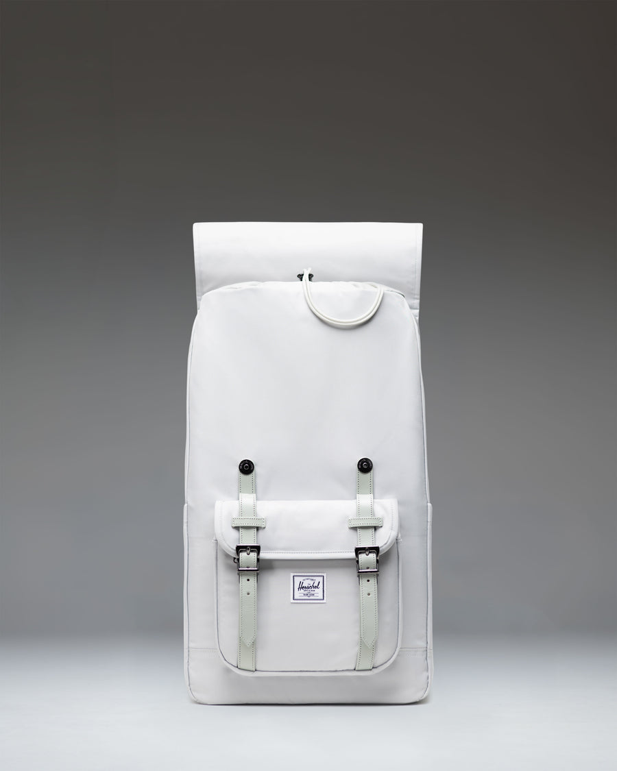 Herschel Little America Backpack in Metal, a grey mountaineering-style bag with dual magnetic strap closures and a zippered front pocket.