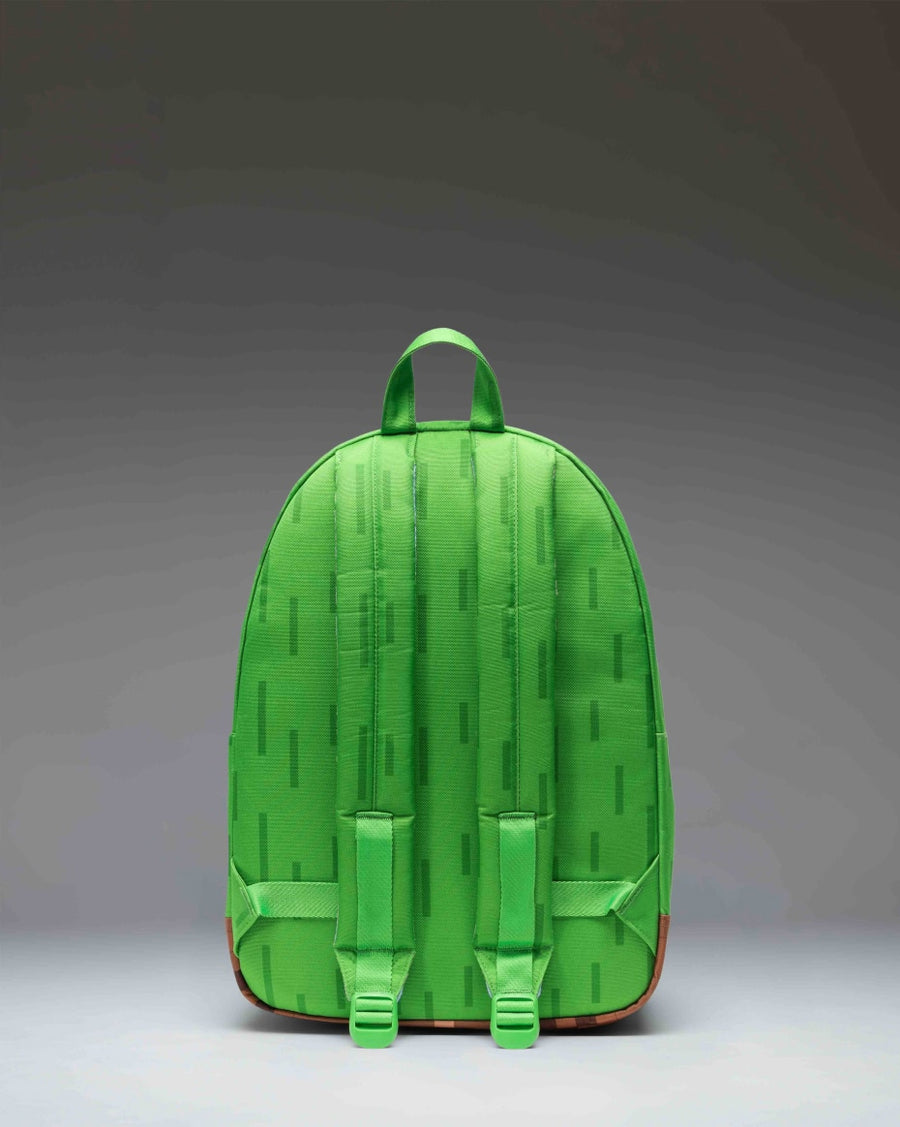 Herschel Supply Co. Minecraft Classic Backpack in The Overworld colorway, featuring a pixelated green and blue pattern.