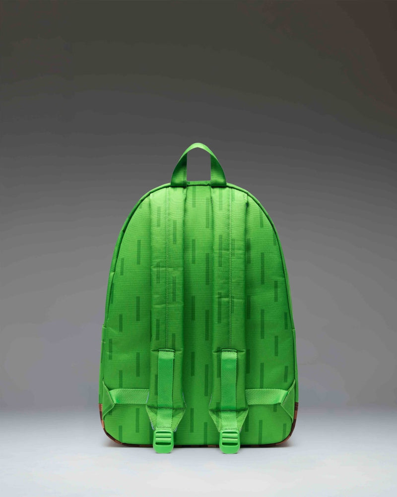 Minecraft Herschel Classic XL Backpack in The Overworld colorway, featuring pixelated landscape prints from the game.