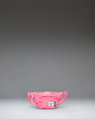 Pink Herschel Supply Co. x Minecraft Heritage Hip Pack with a pixelated Pink Sheep pattern and classic woven label.