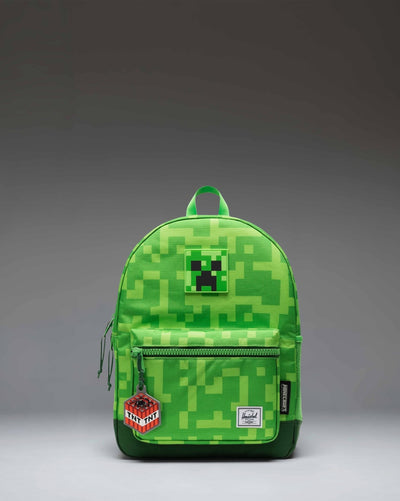 Herschel Supply Co. Minecraft Heritage Kids Backpack in the green pixelated Creeper pattern design.