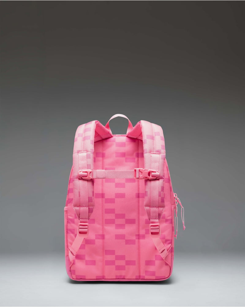 Minecraft Herschel Heritage Kids Backpack in Pink Sheep, featuring a pixelated pink design inspired by the game, shown from the front.
