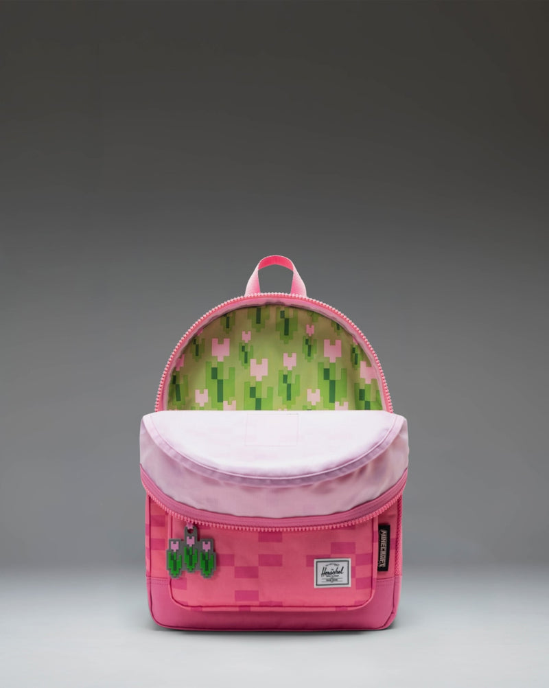 Herschel Supply Co. Minecraft Herschel Heritage Kids Backpack in Pink Sheep, featuring a pixelated pink design.
