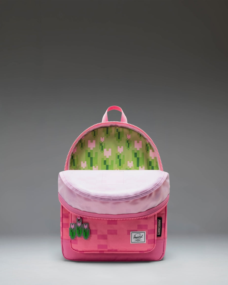 Herschel Supply Co. Minecraft Herschel Heritage Kids Backpack in Pink Sheep, featuring a pixelated pink design.