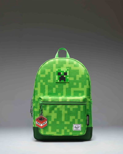 Herschel Supply Co. Minecraft Heritage Youth Backpack in the green pixelated Creeper pattern.