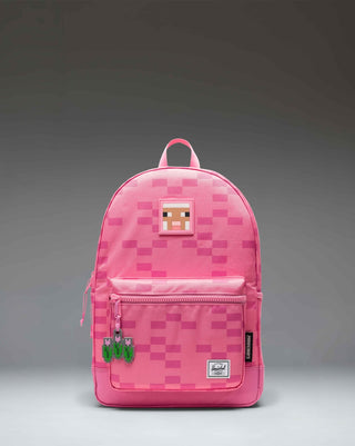 Herschel Supply Co. Minecraft Heritage Youth Backpack in Pink Sheep, featuring a pixelated pink Minecraft sheep print design.