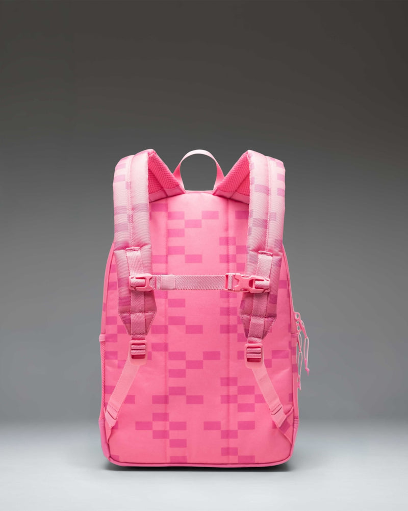 Minecraft Herschel Heritage Youth Backpack in Pink Sheep color featuring a pixelated pink pattern and a classic brown rubber diamond accent.