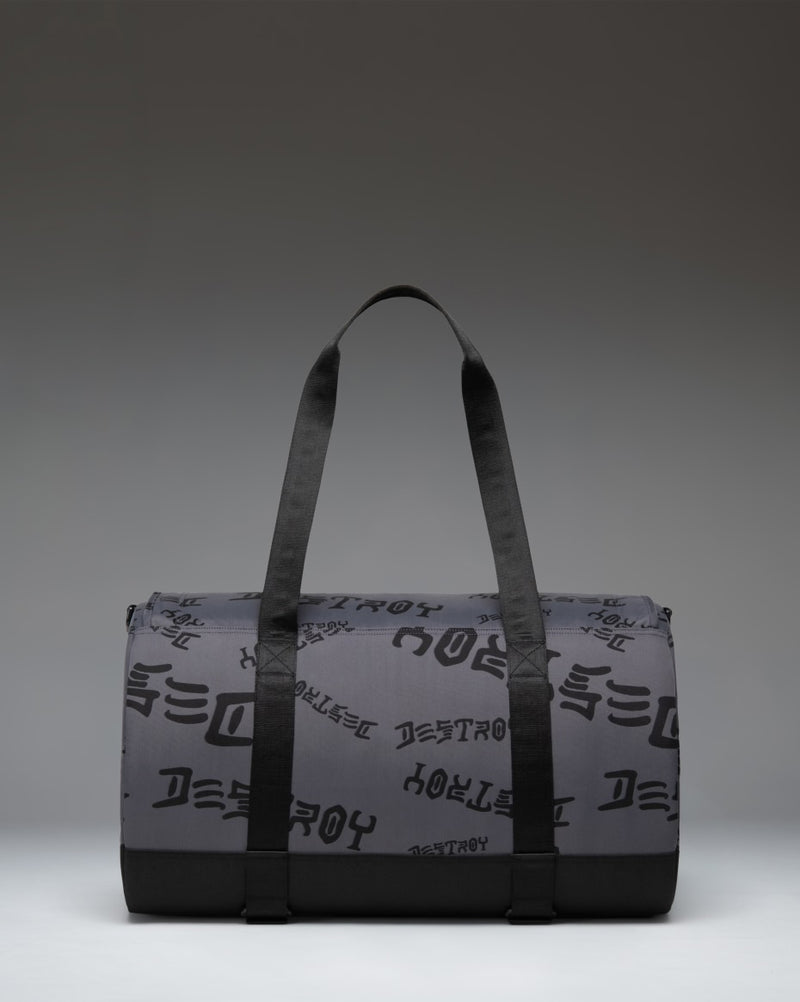 Herschel Supply Co. x Thrasher Heritage Skate Duffle bag in Asphalt/Black Destroy nylon fabric featuring dual top handles and skate straps.
