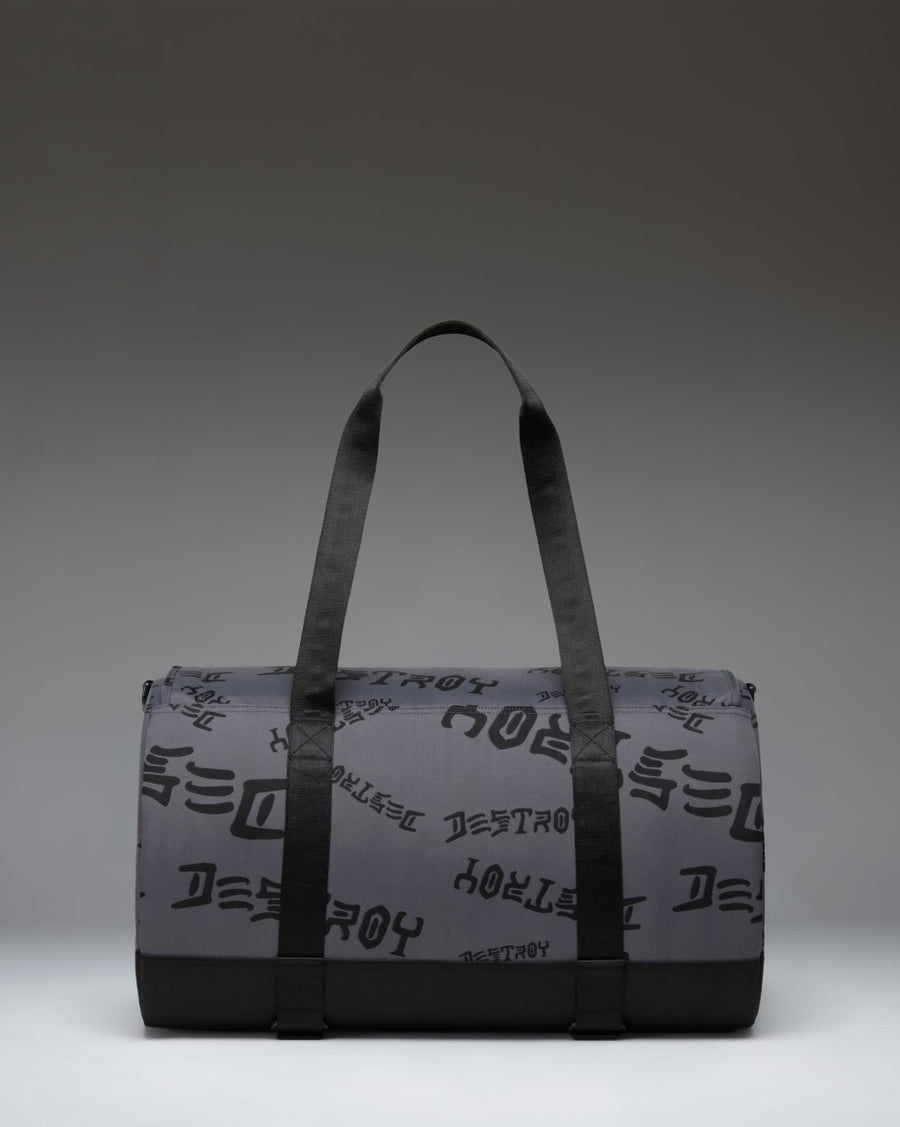 Herschel Supply Co. x Thrasher Heritage Skate Duffle bag in Asphalt/Black Destroy nylon fabric featuring dual top handles and skate straps.