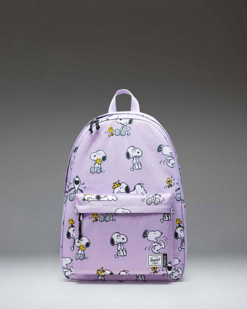 Herschel Classic XL Backpack in Peanuts Snoopy and Woodstock Pastel Lilac, featuring an all-over character print on a light purple background.