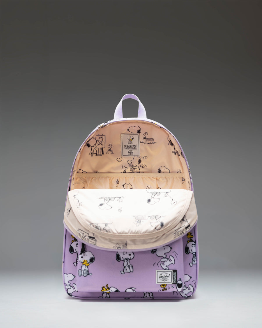 Herschel Supply Co. Peanuts Classic XL Backpack in Snoopy and Woodstock Pastel Lilac showing the front view with zippered pocket.