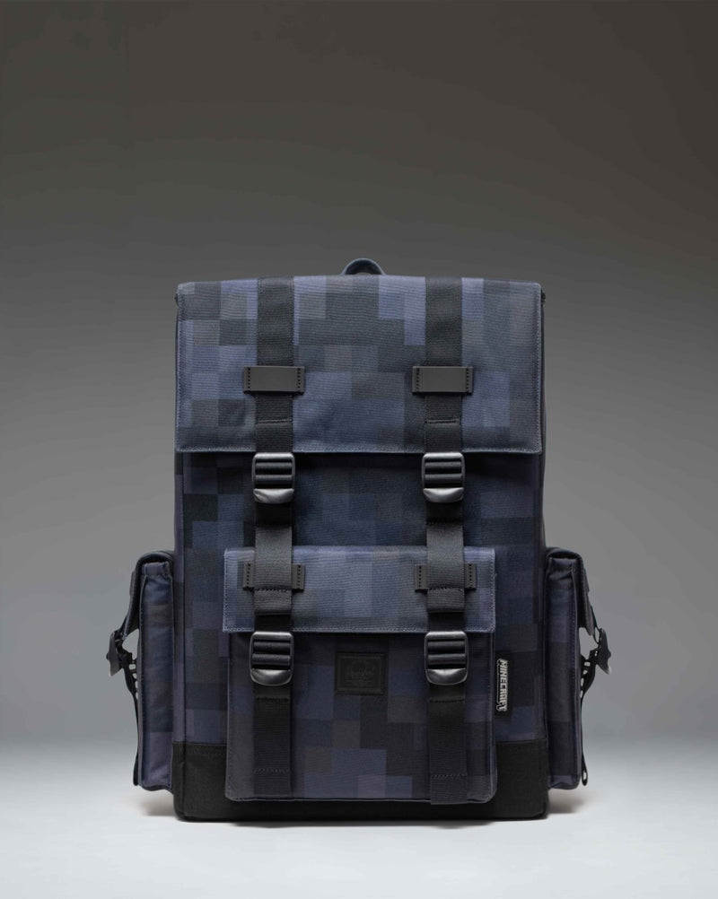 Minecraft Herschel Little America Cube Backpack in Black Block featuring a pixelated black and grey pattern with black straps.