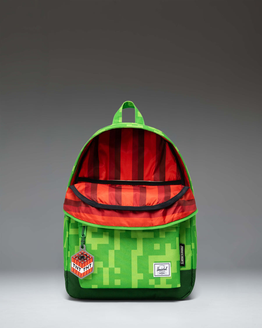 Herschel Supply Co. x Minecraft Heritage Youth Backpack in the green Creeper pixel pattern.