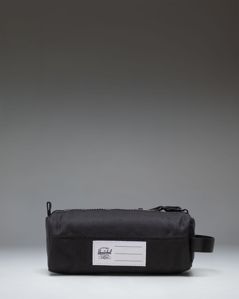Black Herschel Supply Co. Settlement Pencil Case Little Herschel shown from an angled front view, featuring a classic zippered design.