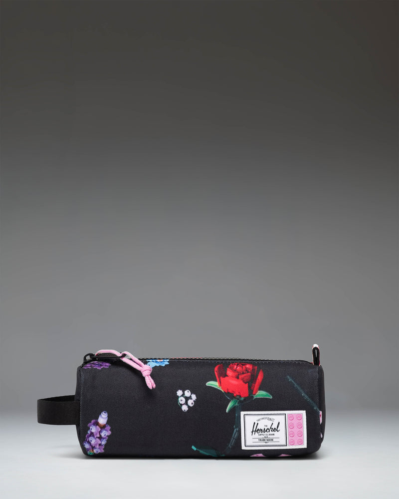 LEGO Settlement Pencil Case Little Herschel in Falling Florals print featuring colorful Lego blocks and flowers on a dark background.