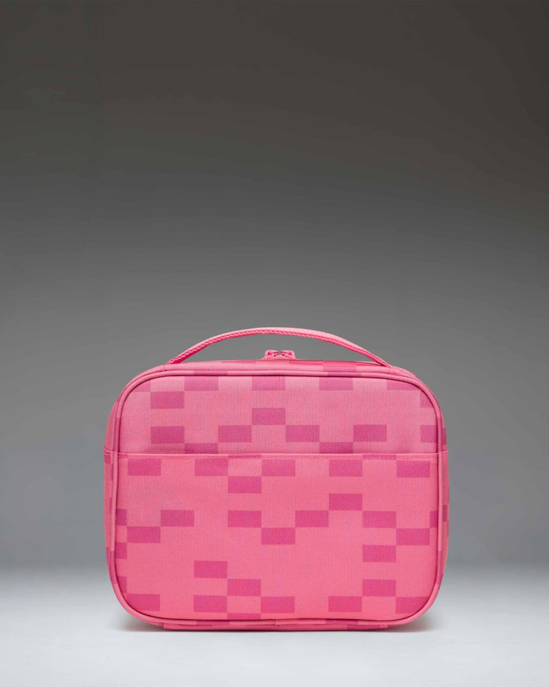 Herschel Supply Co. Minecraft Pop Quiz Lunch Box in Pink Sheep, featuring a pixelated pink sheep face from Minecraft on a pink background.