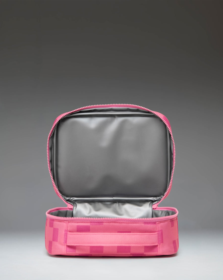 Pink Minecraft Pink Sheep lunch box by Herschel Supply Co. featuring a pixelated sheep pattern and front storage pocket.