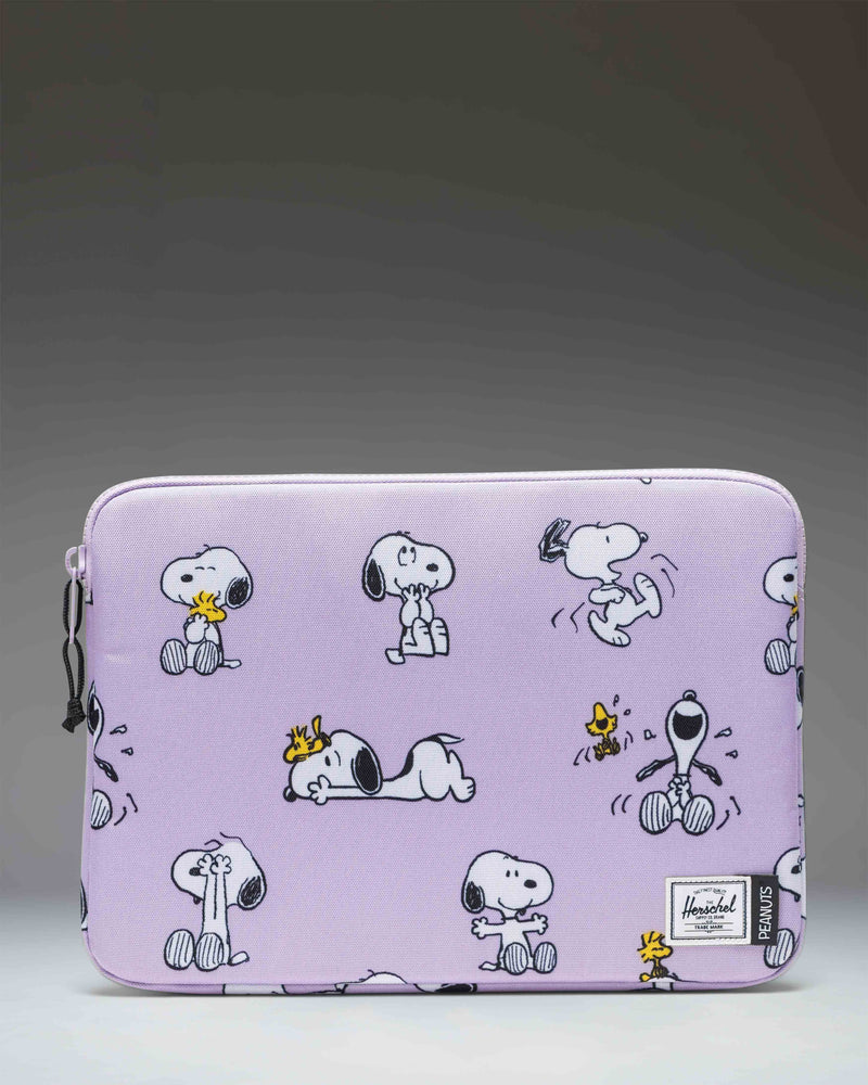 Herschel Supply Co. Peanuts Anchor 14 Inch Laptop Sleeve in Snoopy and Woodstock Pastel Lilac, front view.