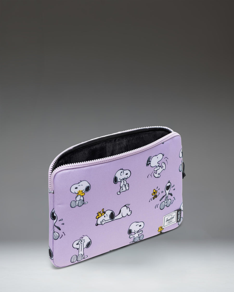Herschel Supply Co. Peanuts Anchor 14 Inch Sleeve in Snoopy and Woodstock Pastel Lilac.