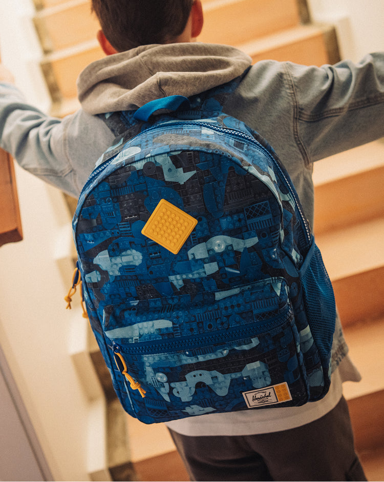 LEGO Herschel Heritage Kids Backpack in Abstract Bricks Blue, featuring a colorful Lego brick pattern.