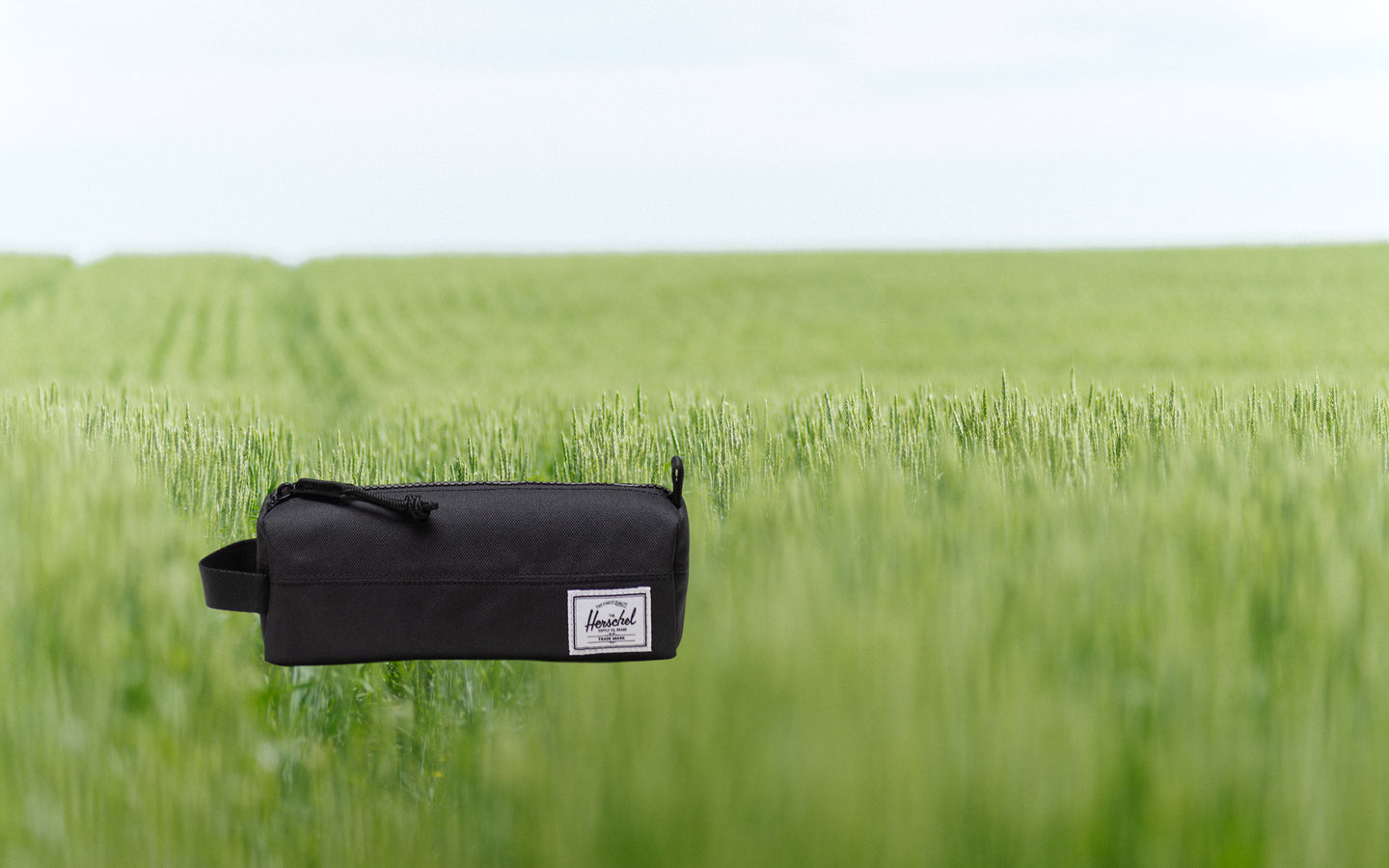 Herschel Supply Co. Settlement Pencil Case Little Herschel in black, showing the front view on a white background.