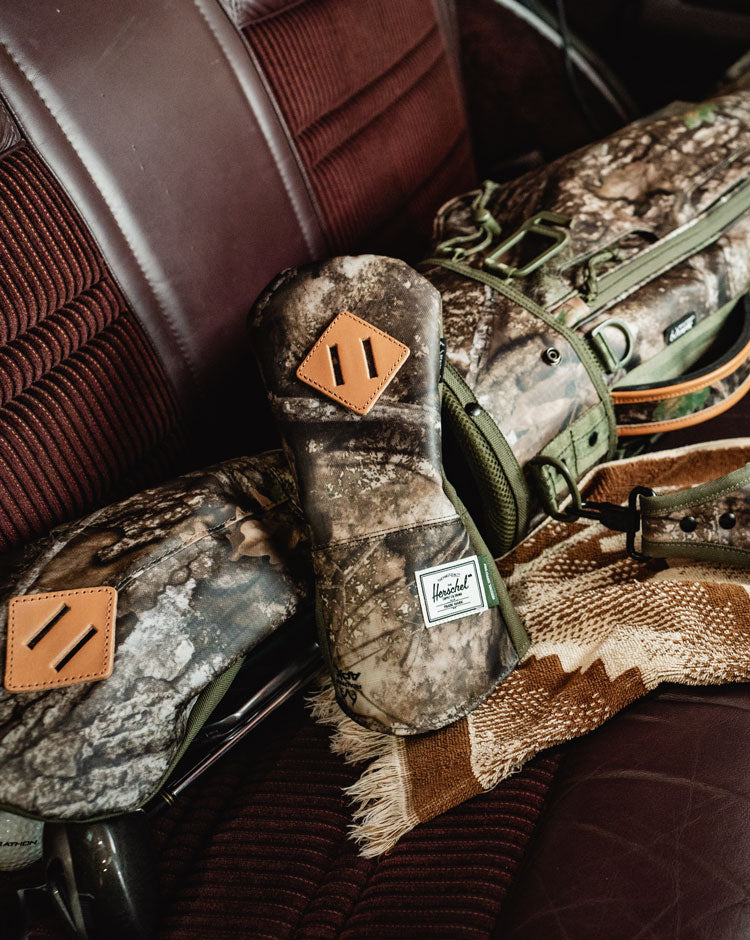 Herschel Supply Co. Realtree Heritage Hybrid Head Cover featuring the Realtree APX Camo pattern.